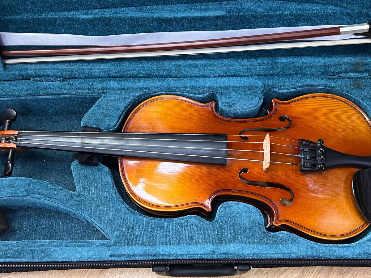 USED 1/2 size violin outfit in oblong case