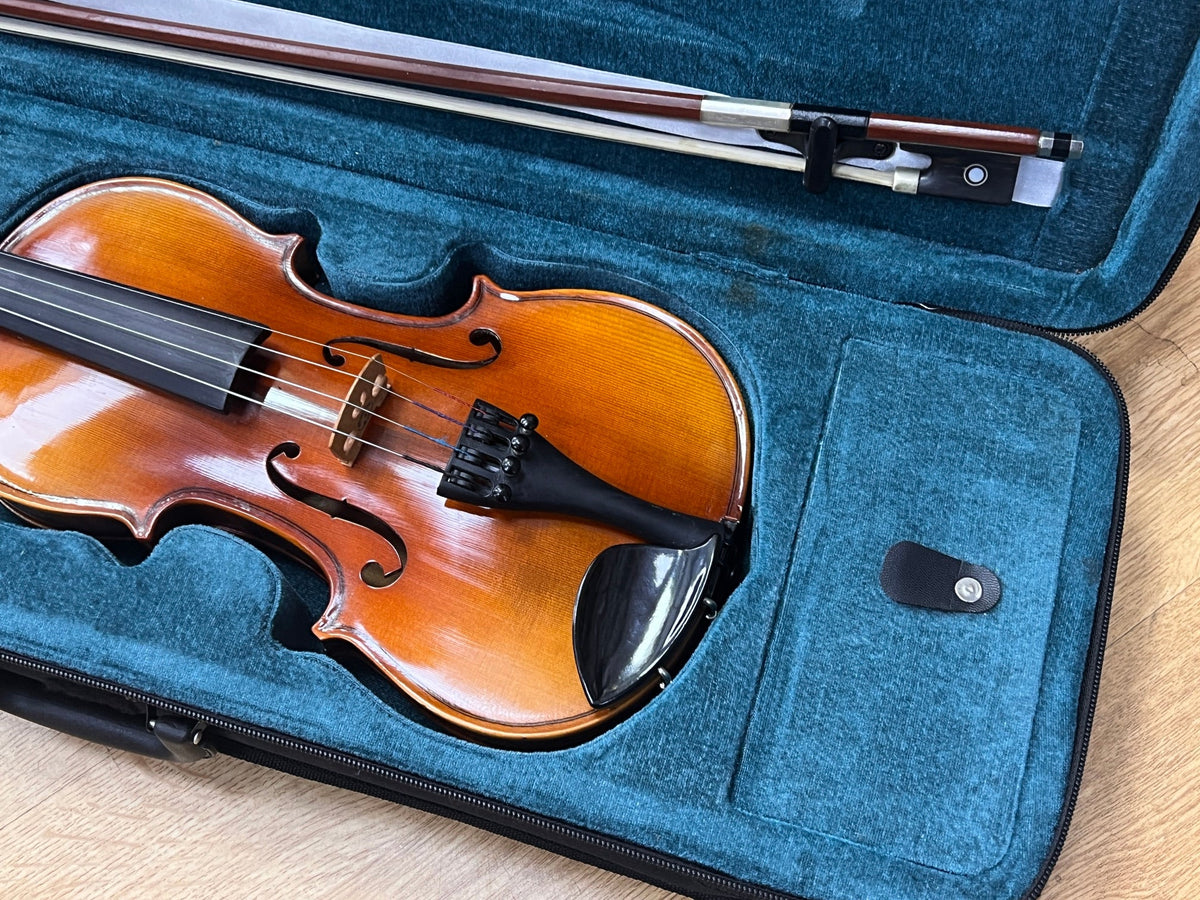 USED 1/2 size violin outfit in oblong case