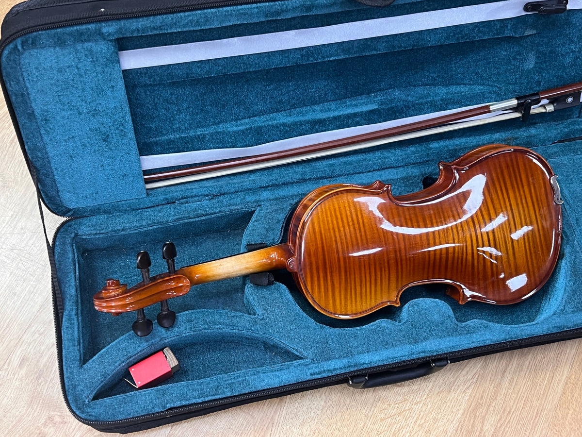USED 1/2 size violin outfit in oblong case