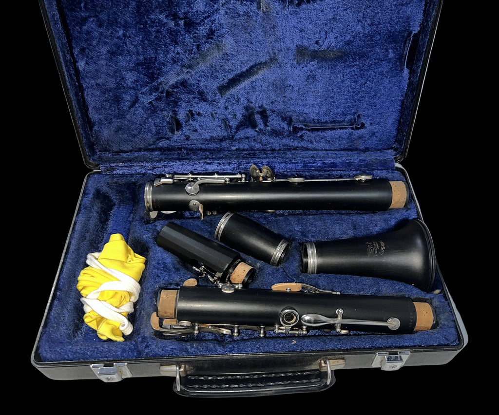Clarinet set in an open case with blue interior