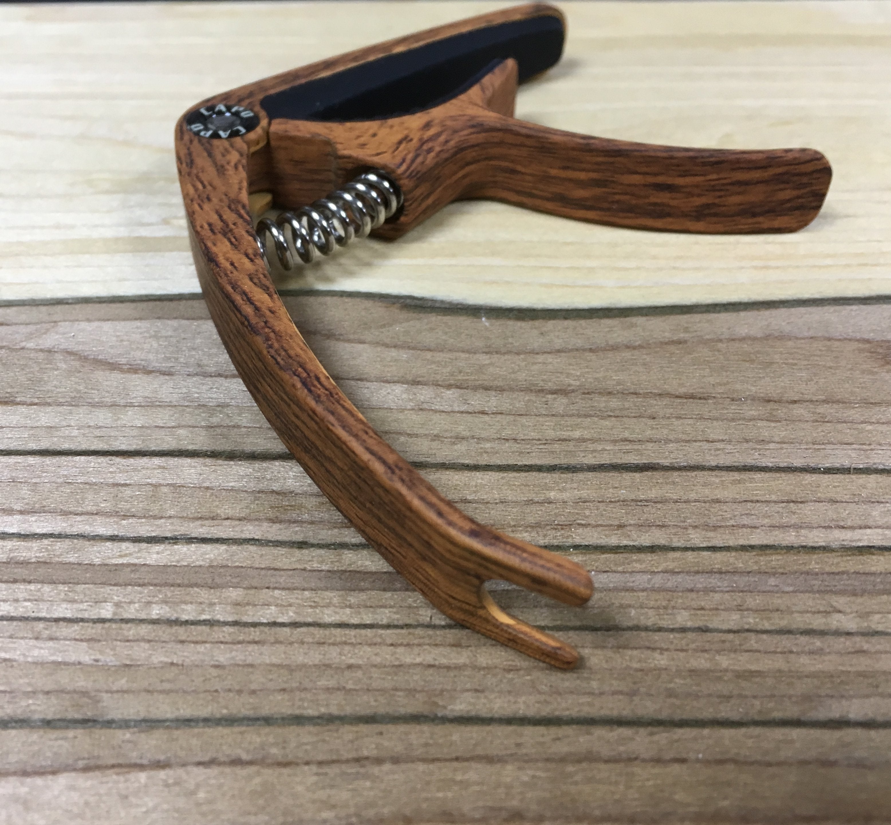 Dark wood effect acoustic / electric guitar capo